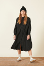 long, loose-fitting black cotton shirt dress